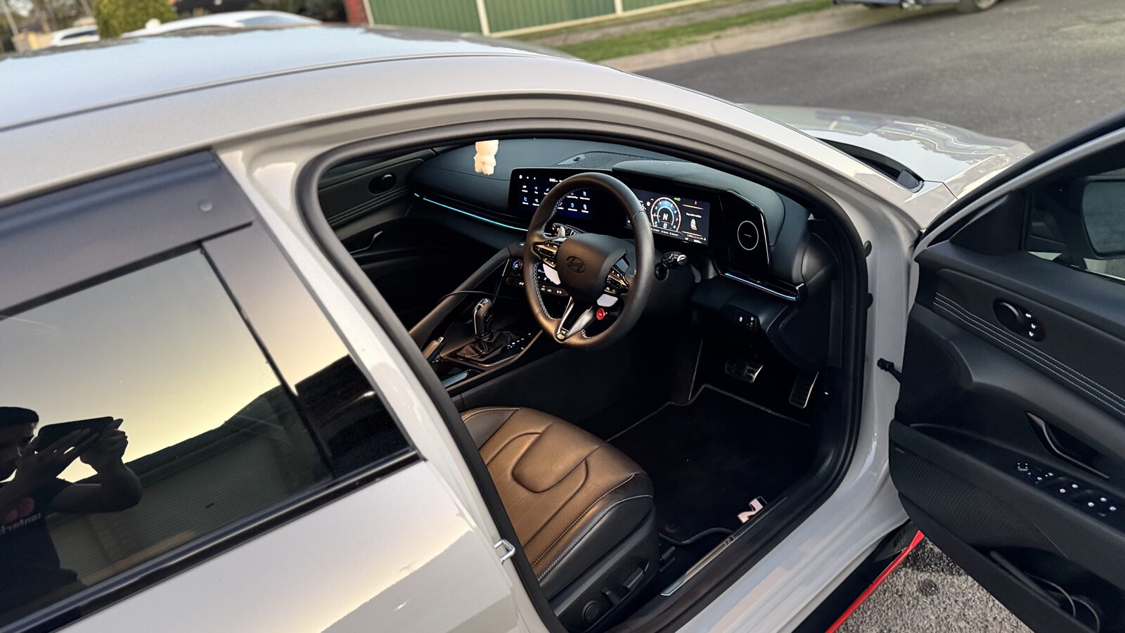 Clean interior of a Hyundai i30 Sedan N seen through the open driver's door