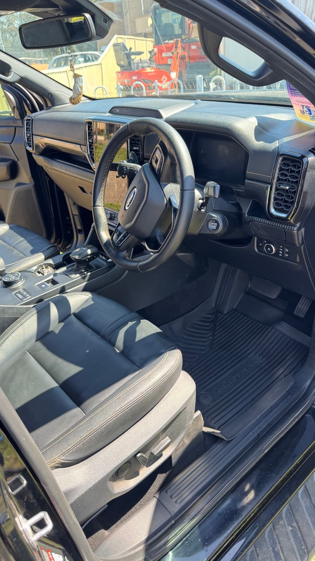 Ford Ranger interior after restoration detail, clean mats and leather